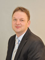 Franz Dilly, Greiner Assistec