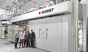 The Nuova Erreplast team: Crescenzo Ottaiano, Converter Manager; Domenico Raccioppoli, CEO; Antonio Pannullo, Printer and Aniello Ruggero, Production Manager, with  Alberto  Vaglio Laurin, Zone Business Director Bobst Italia (left to right), in front of the BOBST EXPERT CI flexo press at Nuova Erreplast in Marcianise, Italy