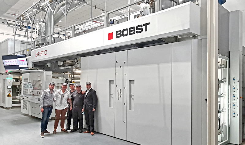 The Nuova Erreplast team: Crescenzo Ottaiano, Converter Manager; Domenico Raccioppoli, CEO; Antonio Pannullo, Printer and Aniello Ruggero, Production Manager, with  Alberto  Vaglio Laurin, Zone Business Director Bobst Italia (left to right), in front of the BOBST EXPERT CI flexo press at Nuova Erreplast in Marcianise, Italy
